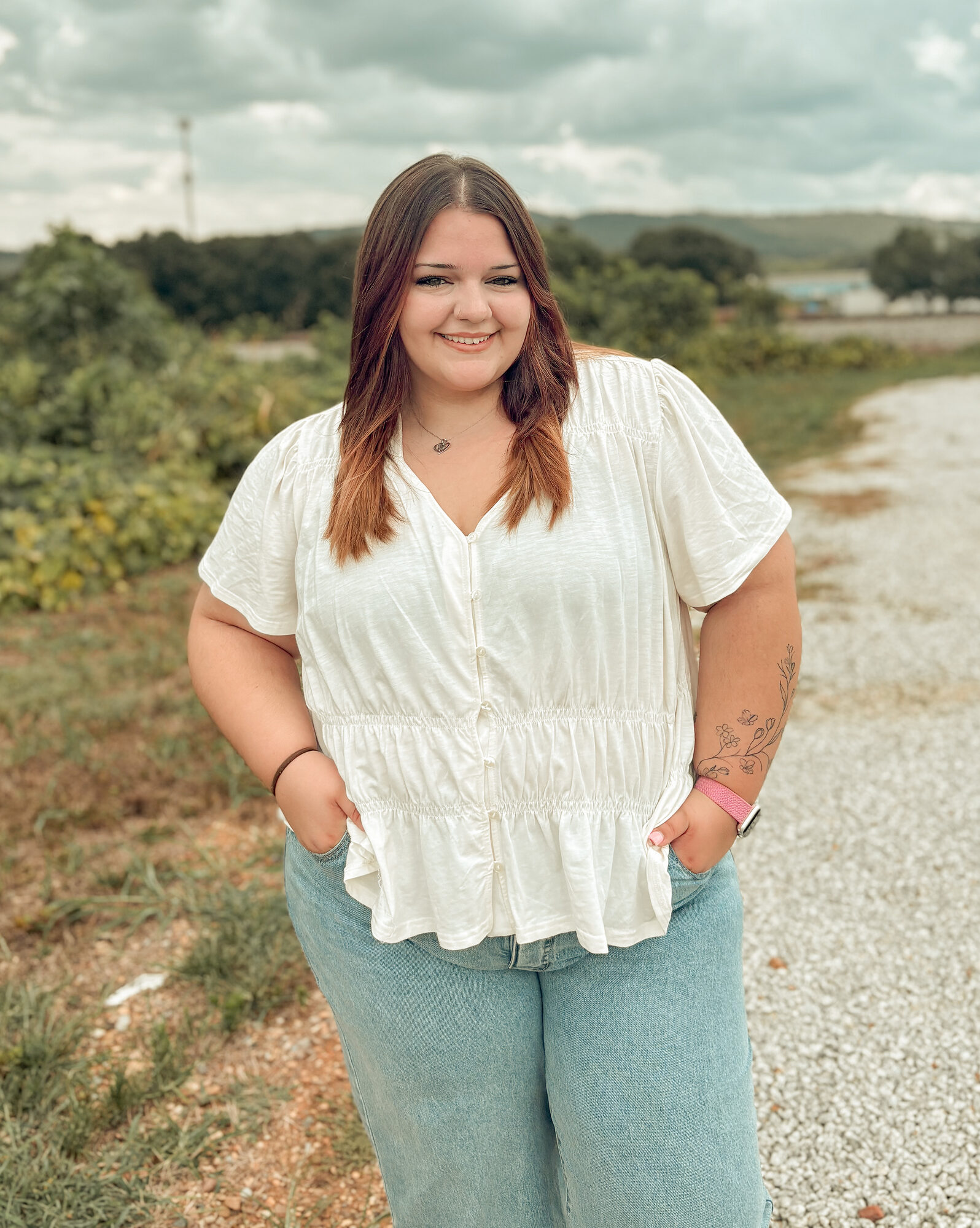 Young woman portrait on a country gravel road