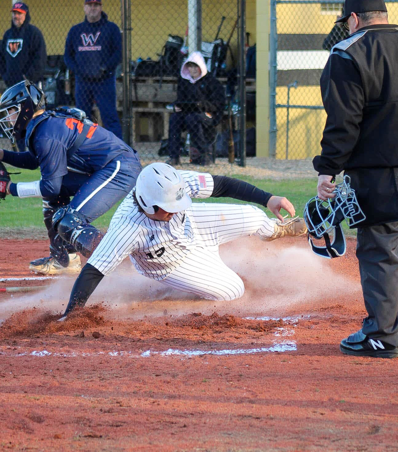 Baseball runner sliding into base