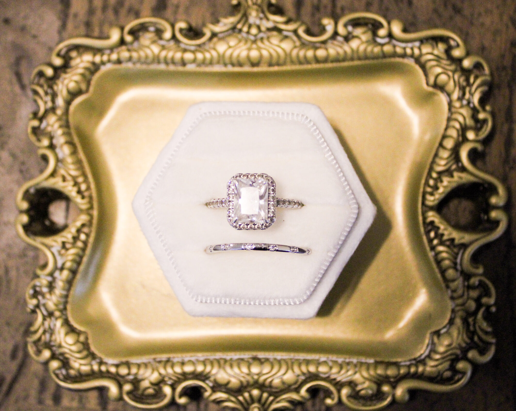 Wedding rings displayed on a gold tray
