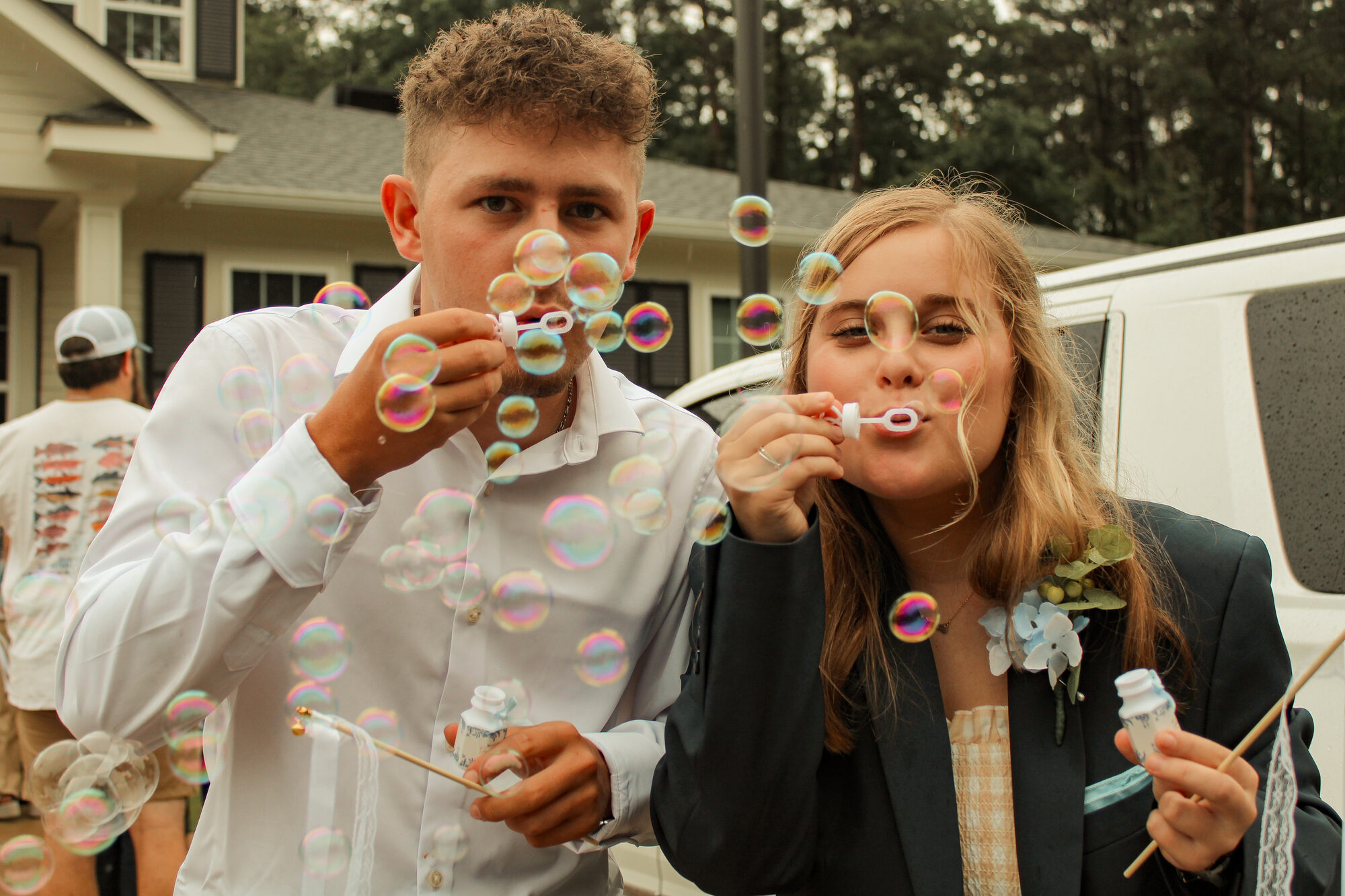 Newlyweds blowing bubbles together